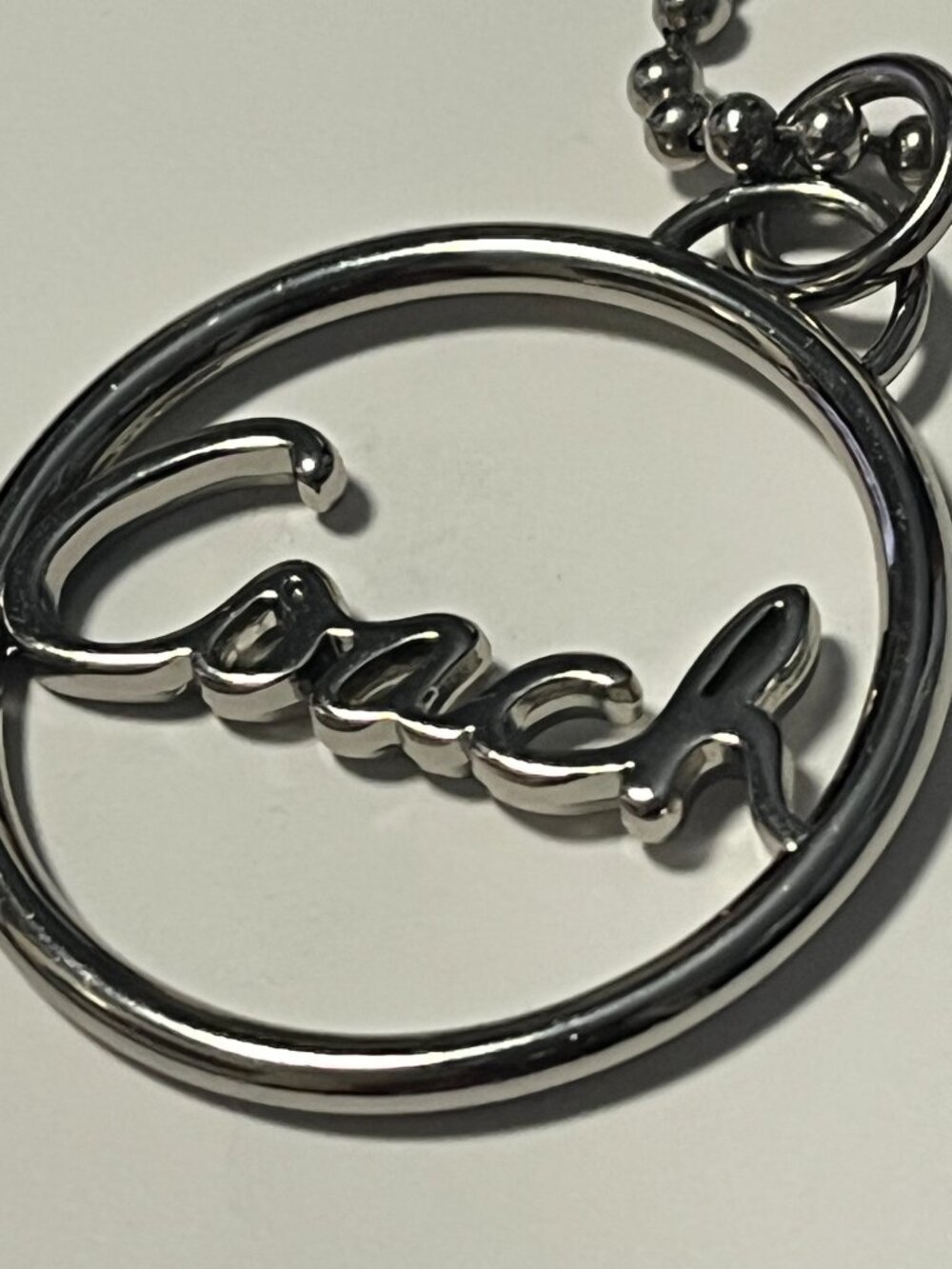 COACH Silver-tone Coach Round Metal Bag Charm - Picture 3 of 3